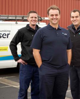 three of our Leisure Citu plumbers standing by their truck